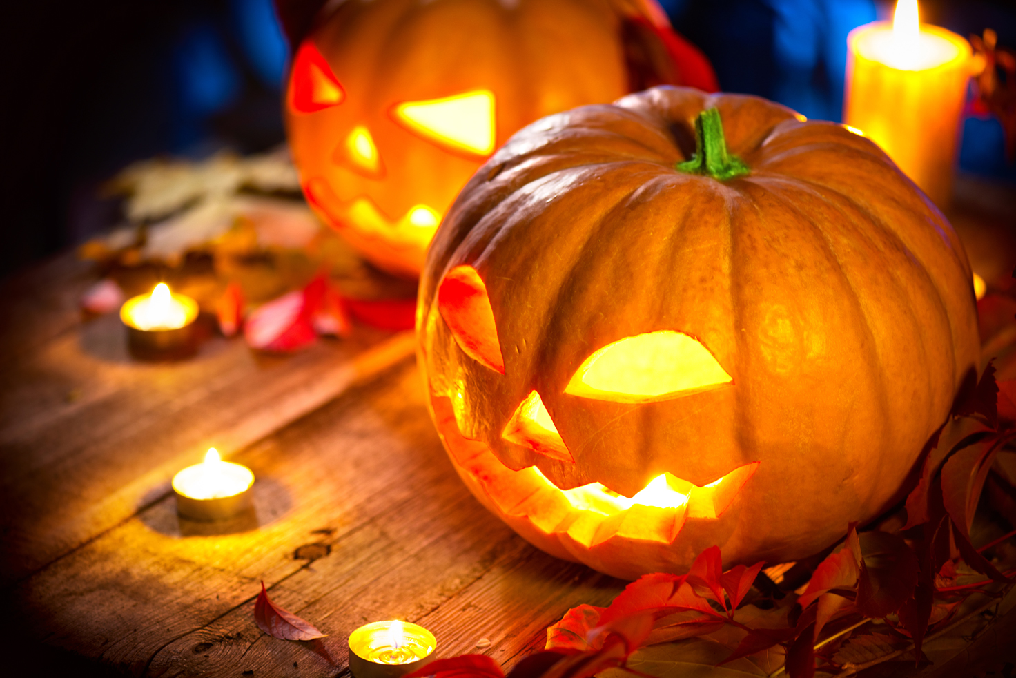 Halloween pumpkin head jack lantern with burning candles